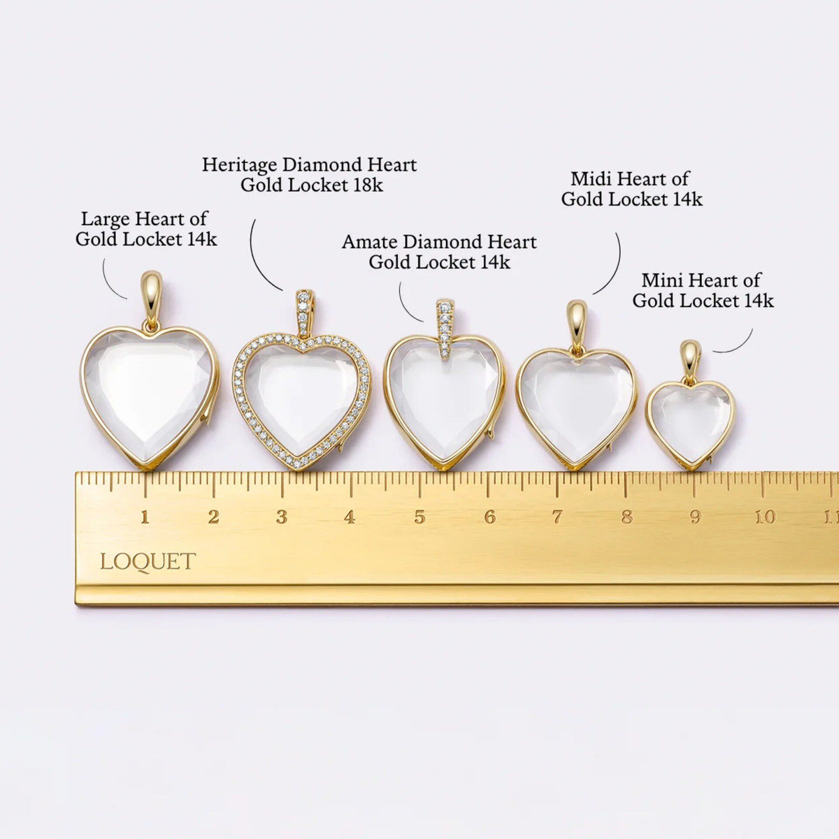 Heart Zircon Glass Locket Charm — five heart glass lockets on a ruler