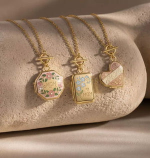 Heart Open Locket Charm — three lockets on stone