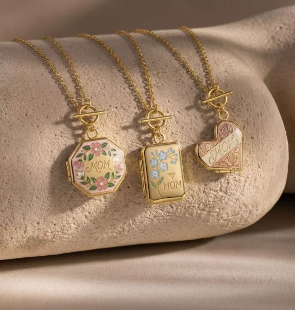 Heart Open Locket Charm — three lockets on stone