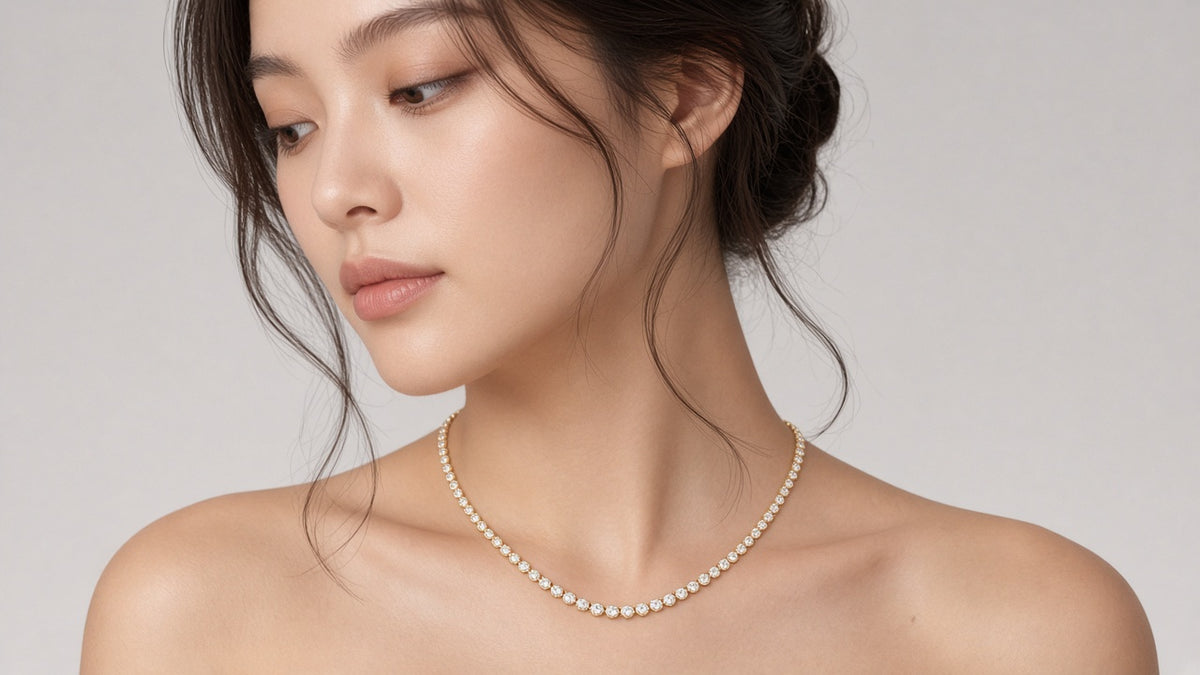 Hérivière Graduated Tennis Necklace on brunette model · ~5ct lab-grown · Maison Alexa