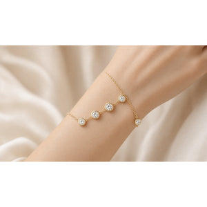 Flottlien Floating Bezel Bracelet worn on wrist — yellow gold lab-grown station bezel Maison Alexa